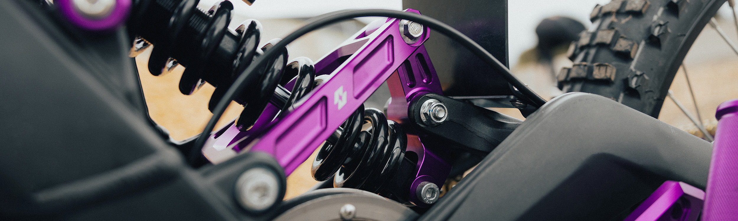 Full-E Charged Reinforced Suspension Linkage With Roller Bearings Purple